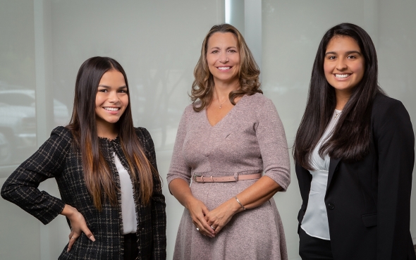 three business woman standing together